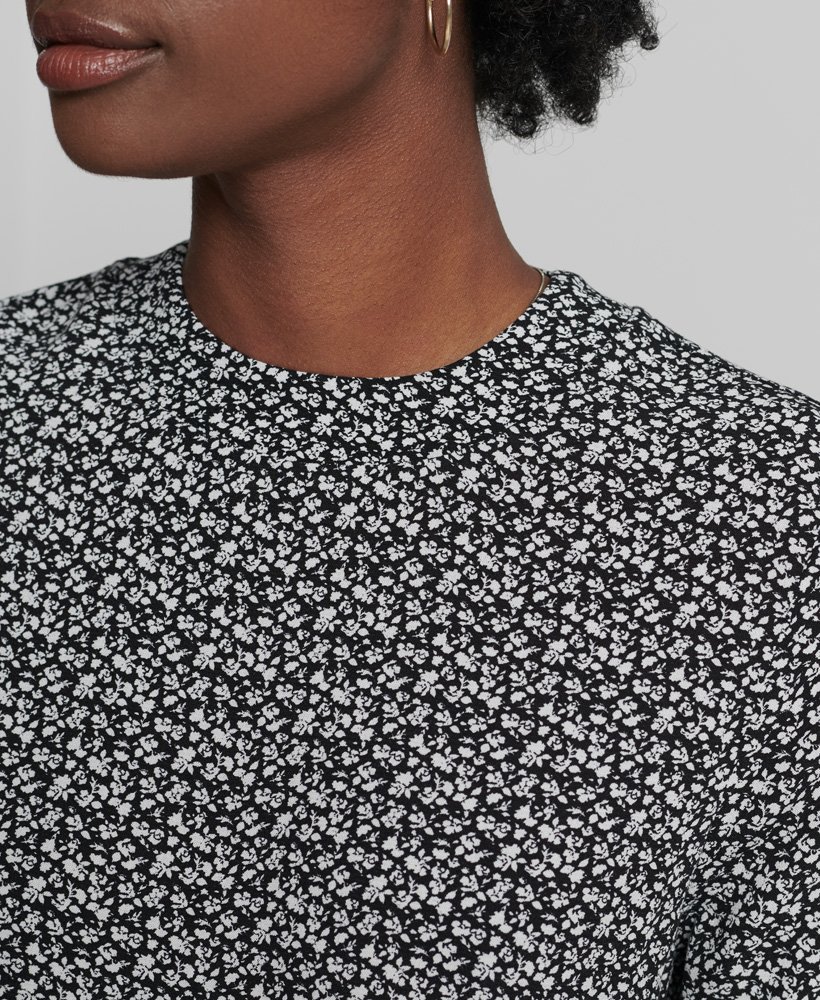 vestido curto de manga comprida em tecido plano com estampa floral londrina preta.