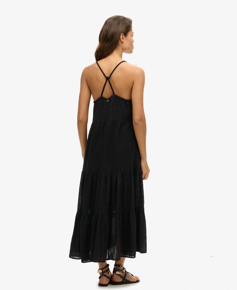 vestido longo vintage de renda preta com alças finas.