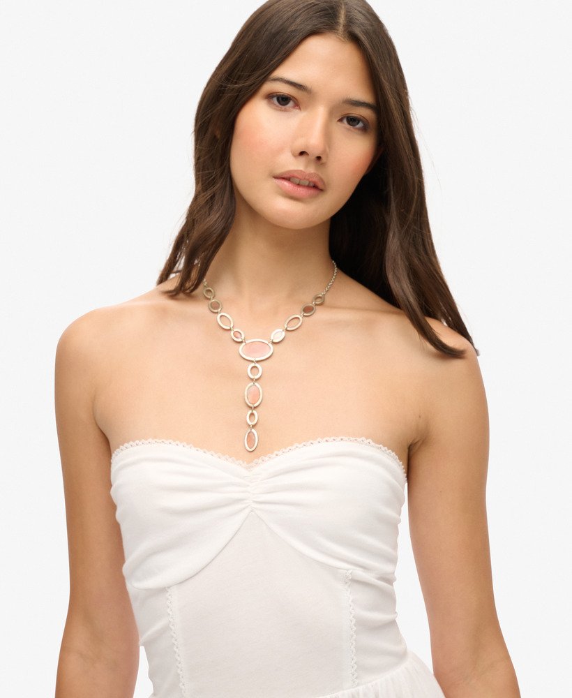 vestido curto bandeau de renda estilo anos 50 na cor óptica.