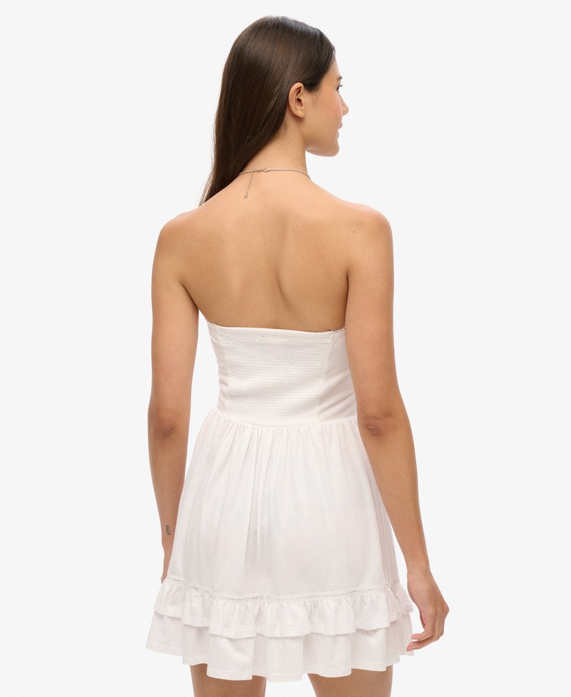 vestido curto bandeau de renda estilo anos 50 na cor óptica.