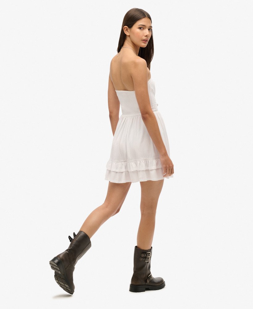 vestido curto bandeau de renda estilo anos 50 na cor óptica.