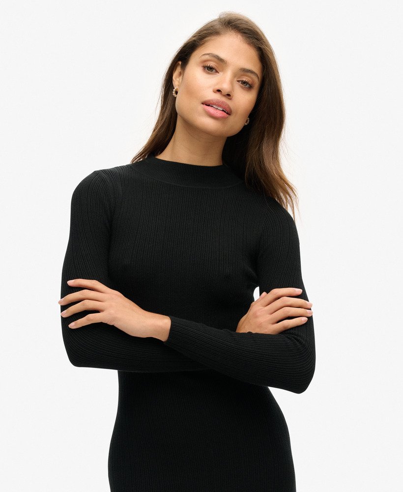 vestido midi justo e sem costas na cor preta.