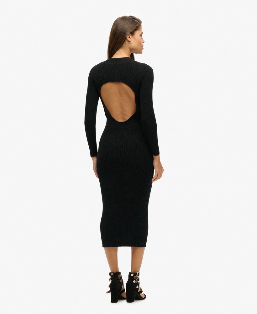 vestido midi justo e sem costas na cor preta.