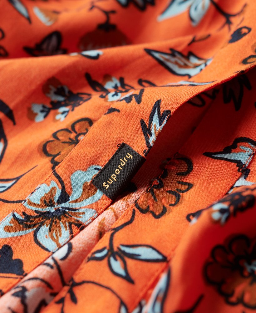 vestido midi estampado com decote em v na cor laranja winterbloom.
