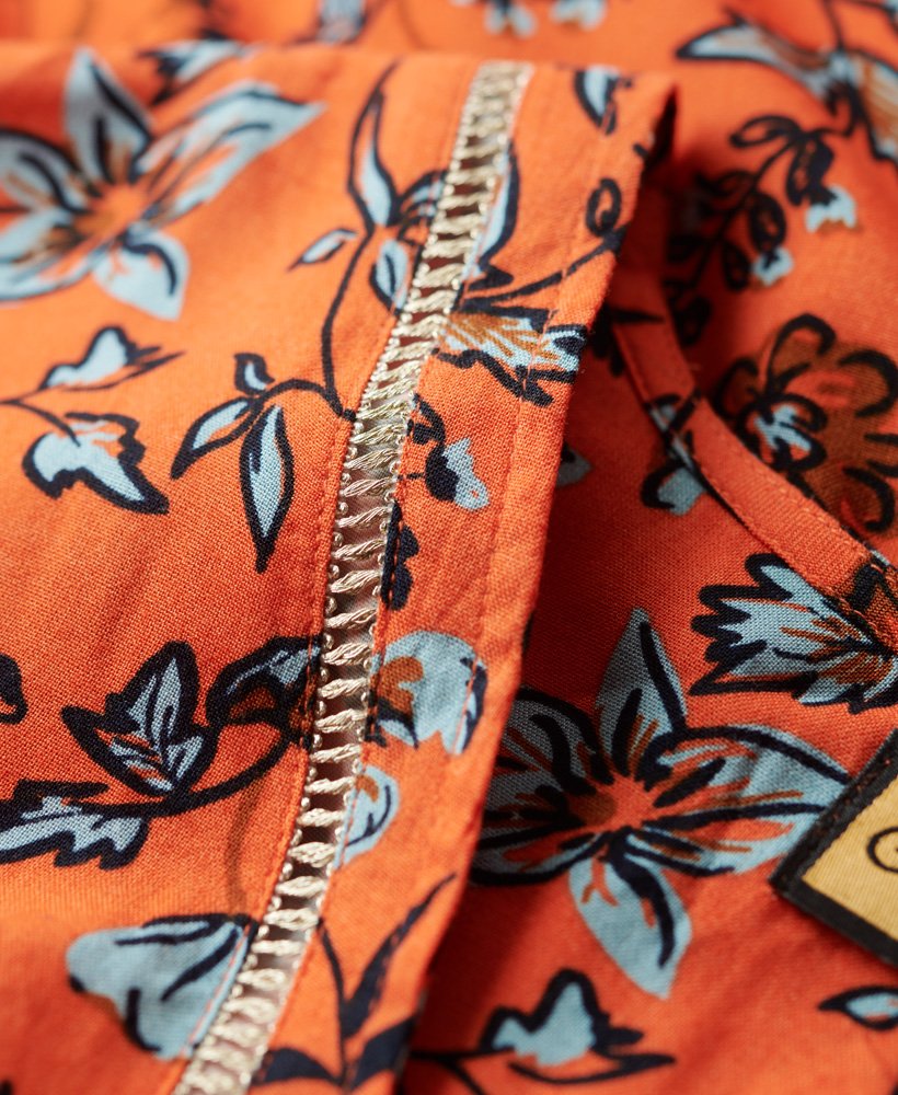 vestido midi estampado com decote em v na cor laranja winterbloom.