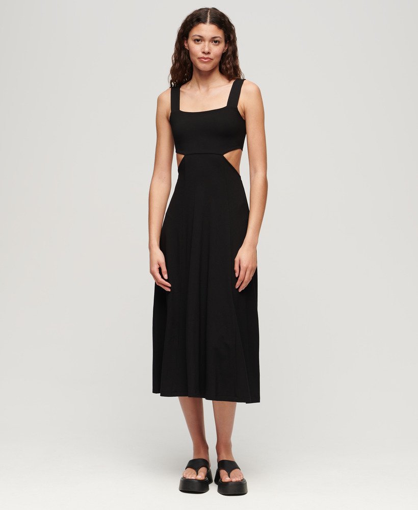 vestido midi de malha com recortes na cor preta.