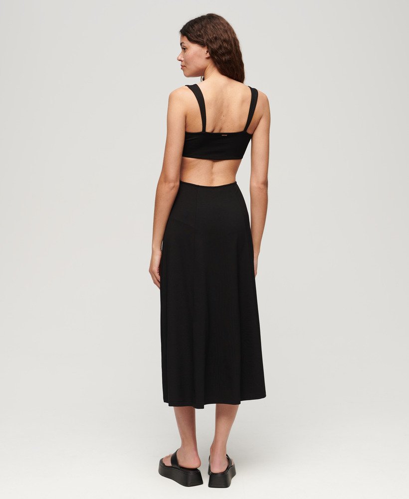 vestido midi de malha com recortes na cor preta.