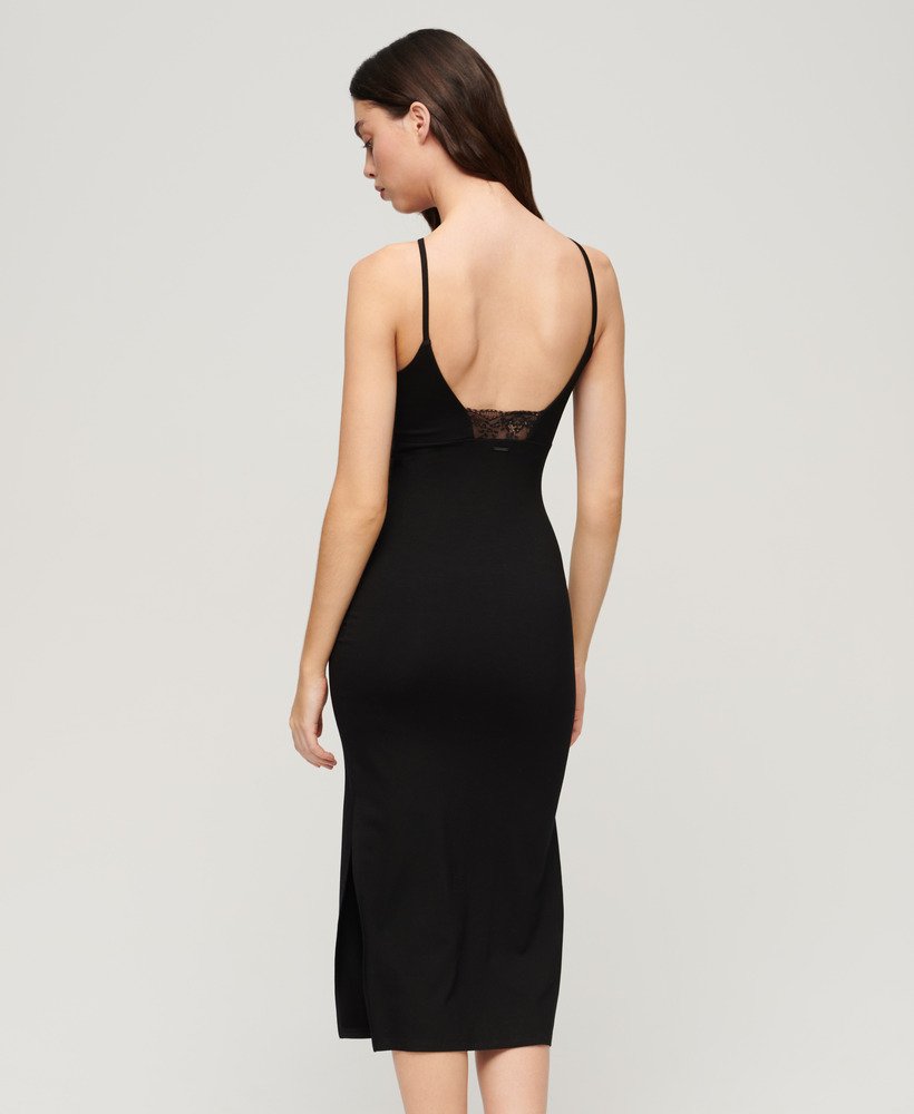 vestido midi de malha com detalhes em renda nas costas na cor preta.