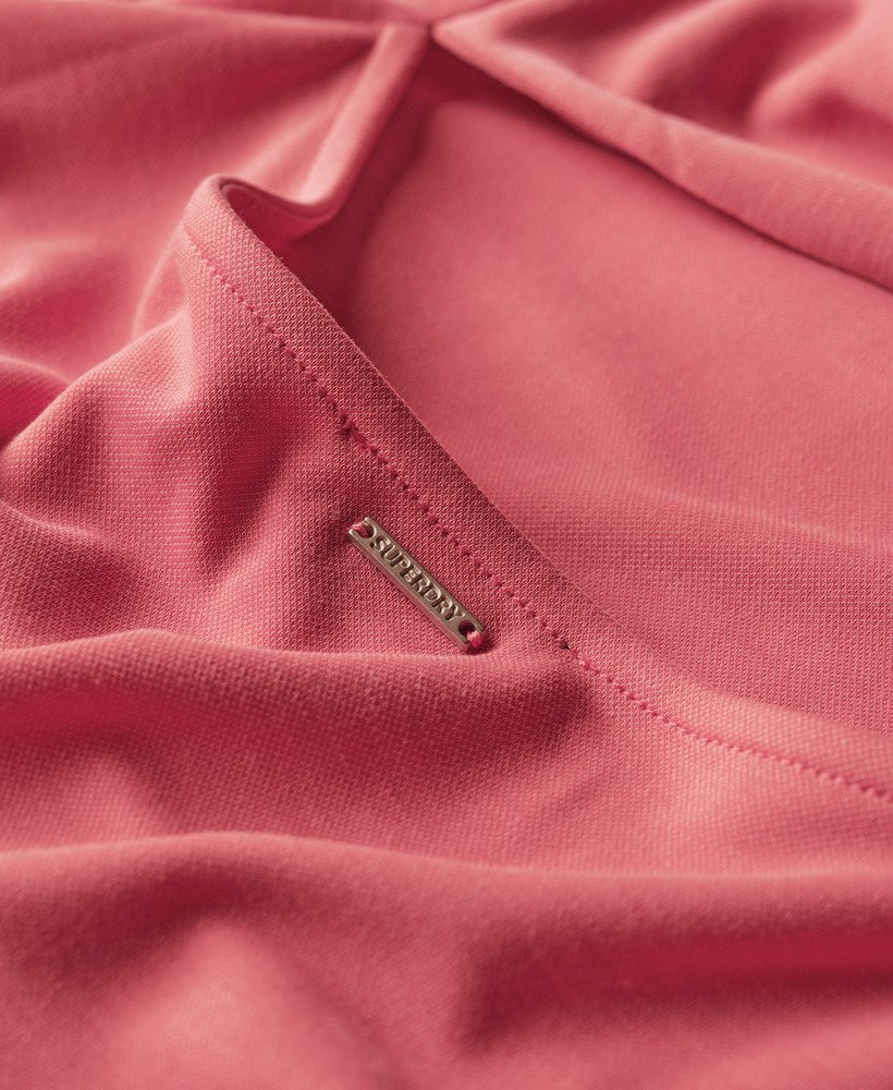 vestido midi em jersey com detalhe torcido nas costas na cor rosa deserto.
