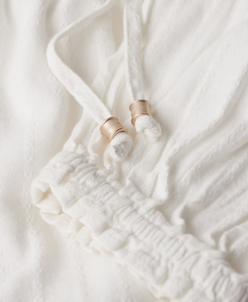 vestido curto ibiza de manga comprida com camadas na cor off white