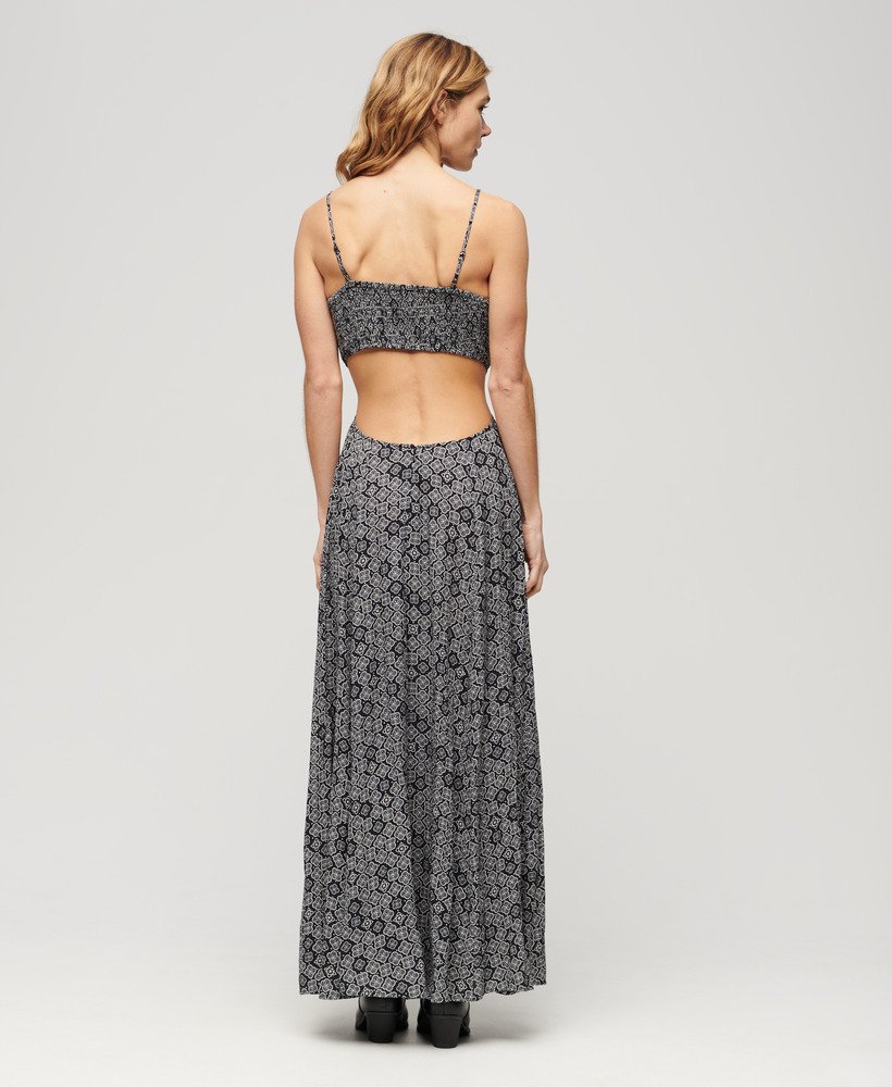 vestido longo com costas transparentes em preto com estampa geométrica dos anos 70.