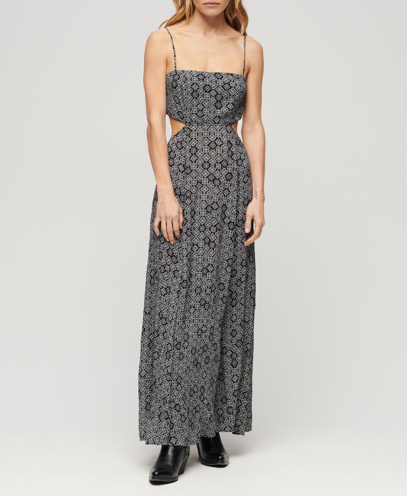 vestido longo com costas transparentes em preto com estampa geométrica dos anos 70.