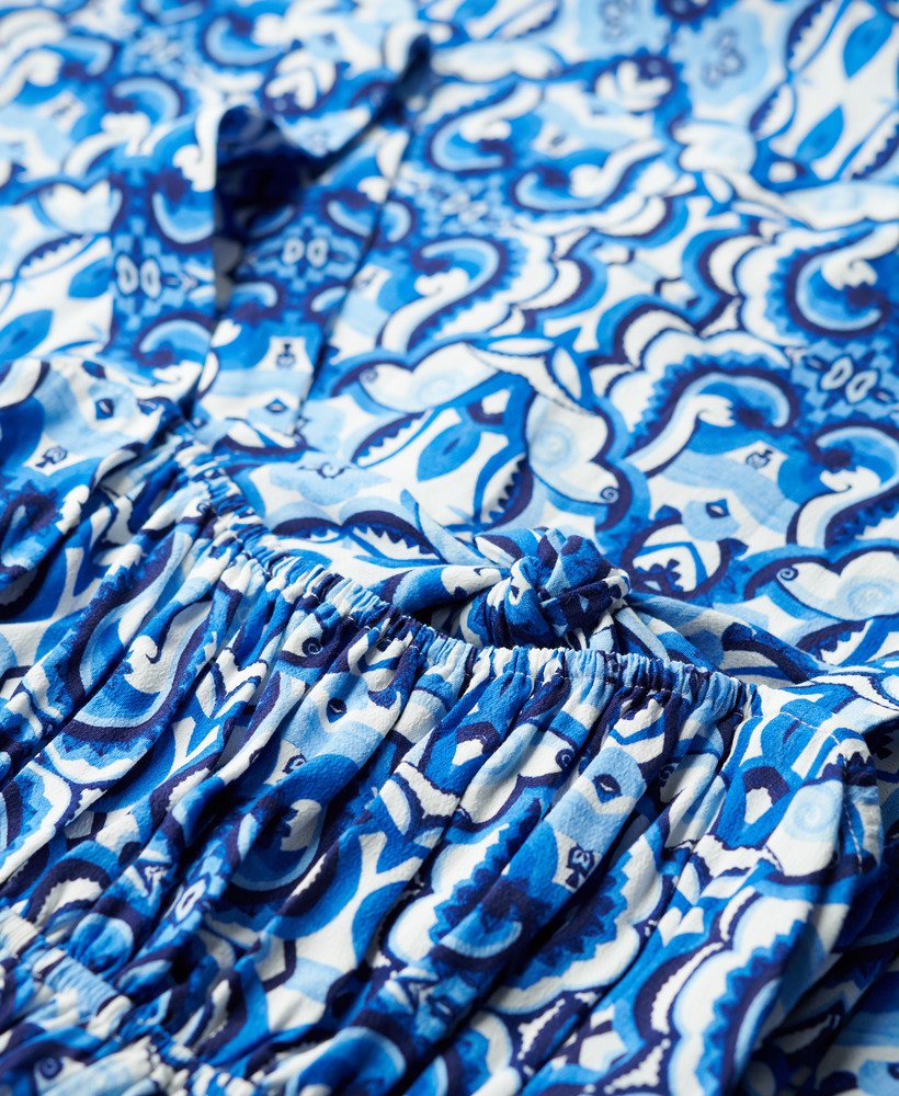 vestido longo com amarração nas costas em estampa de azulejos azul