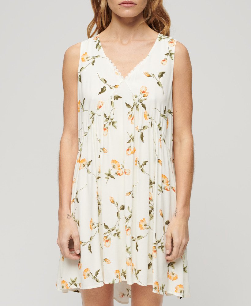 vestido volumoso sem mangas com estampa de rosas cor de pêssego