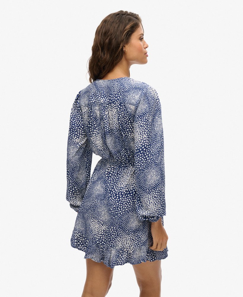 vestido curto envelope de manga comprida com estampa floral miúda azul marinho.