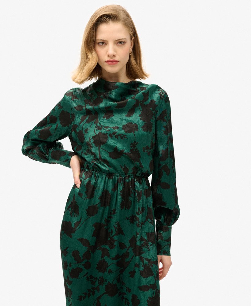 vestido longo jacquard com decote drapeado e estampa floral em tons de azul-petróleo.