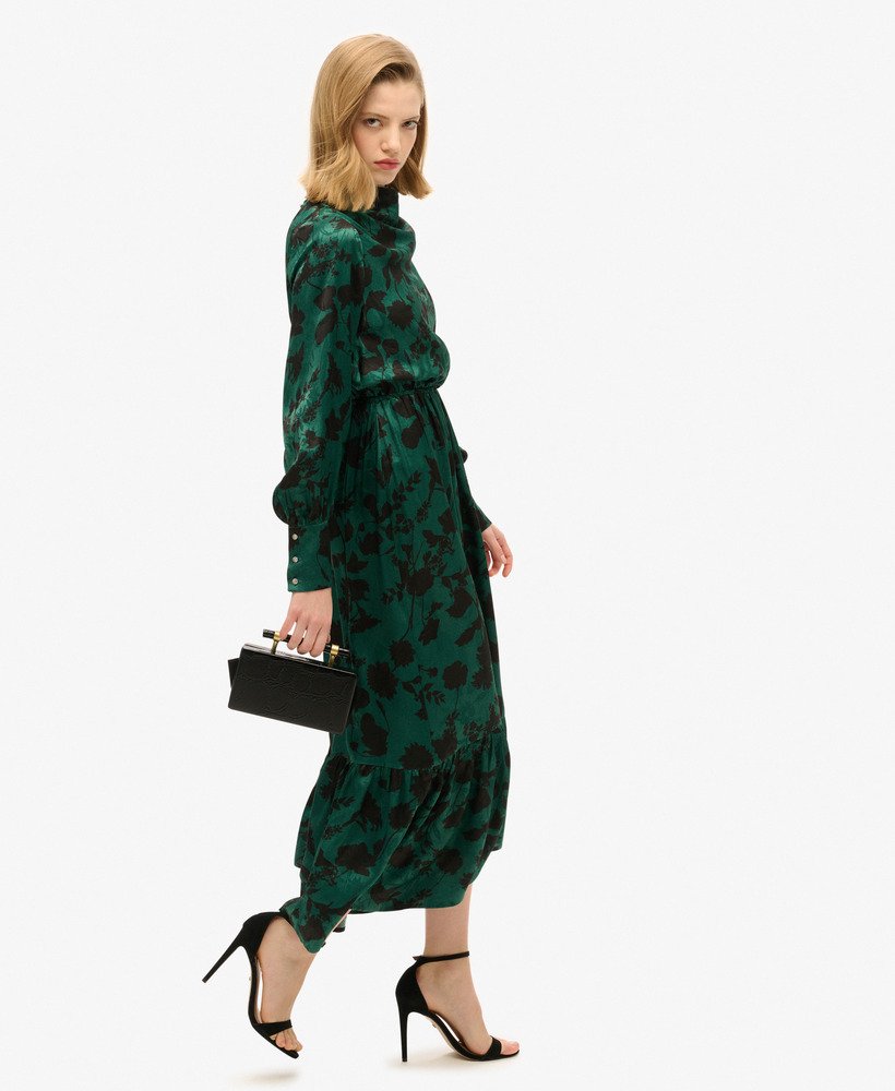vestido longo jacquard com decote drapeado e estampa floral em tons de azul-petróleo.