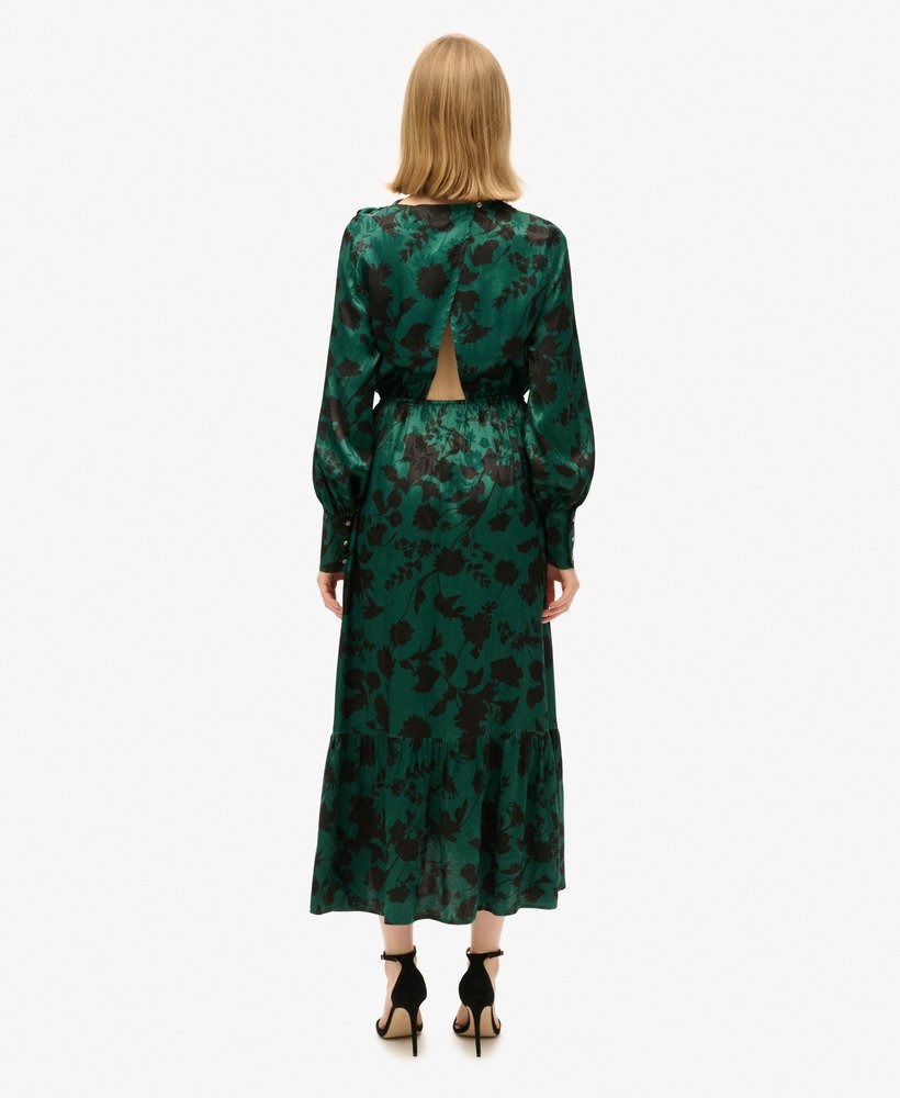 vestido longo jacquard com decote drapeado e estampa floral em tons de azul-petróleo.