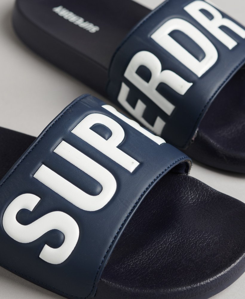 core pool sliders em azul marinho profundoÓptico