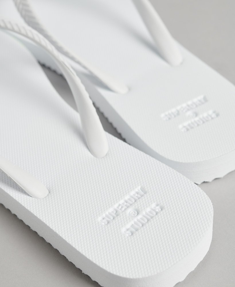 chinelo clássico studios em optic