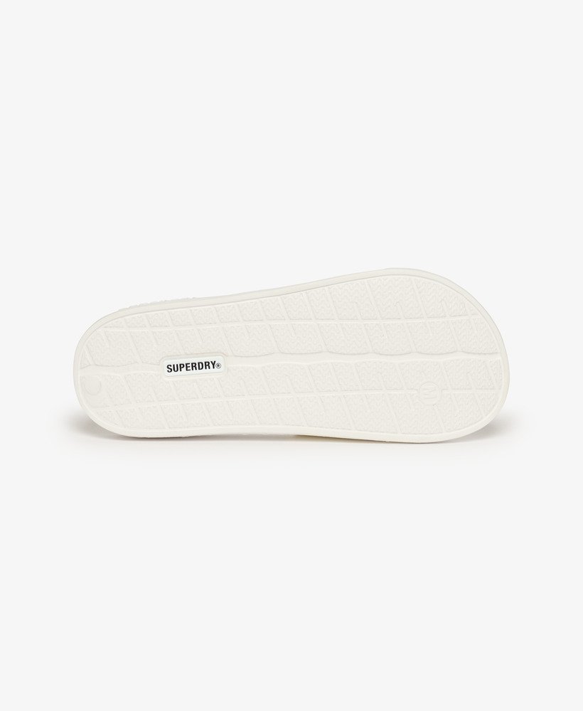 sliders de piscina com o logotipo code em ouro rosa óticometálico