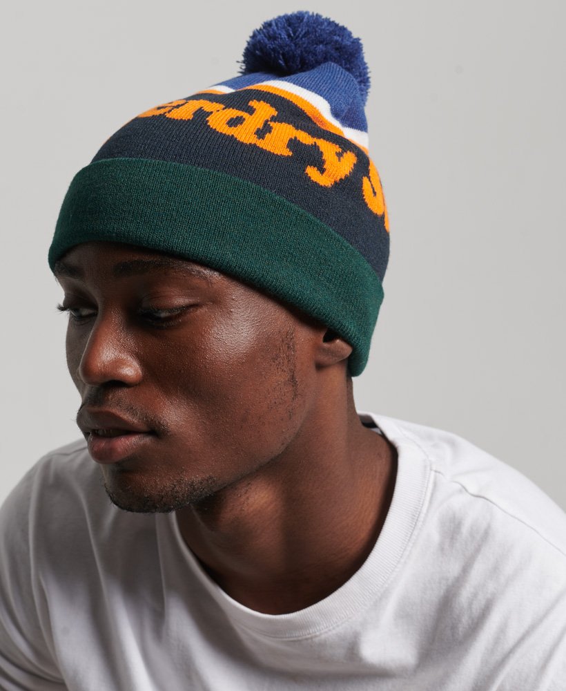 gorro essential logo em azul marinho crepúsculolaranja jaffa