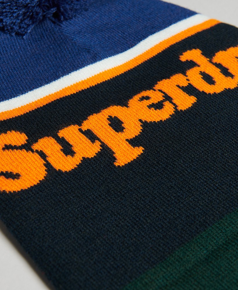 gorro essential logo em azul marinho crepúsculolaranja jaffa
