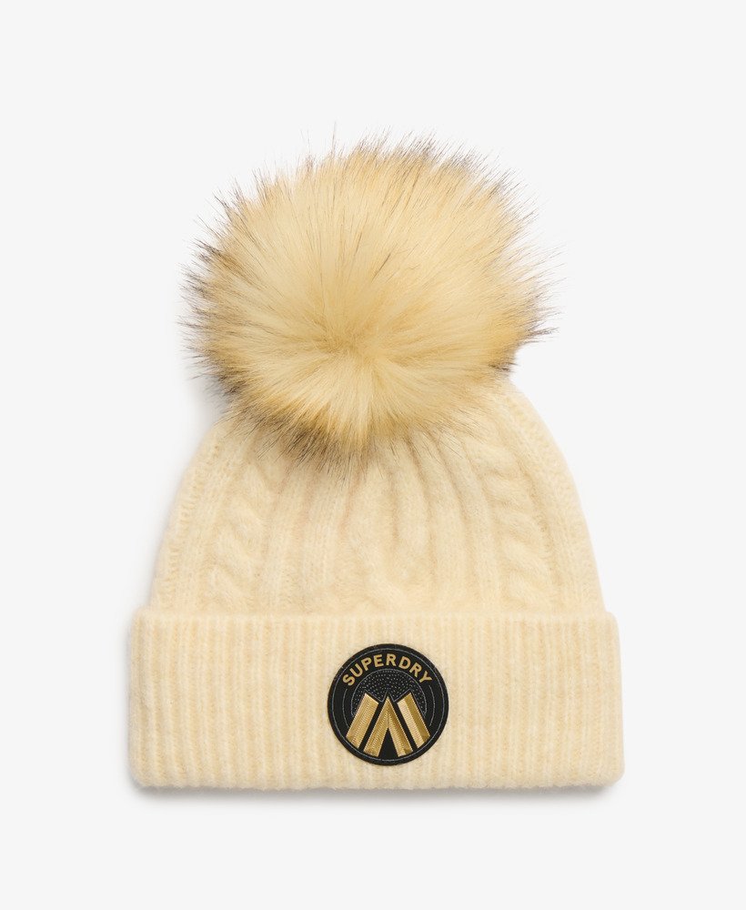 gorro de malha trançada na cor aveia e branco.