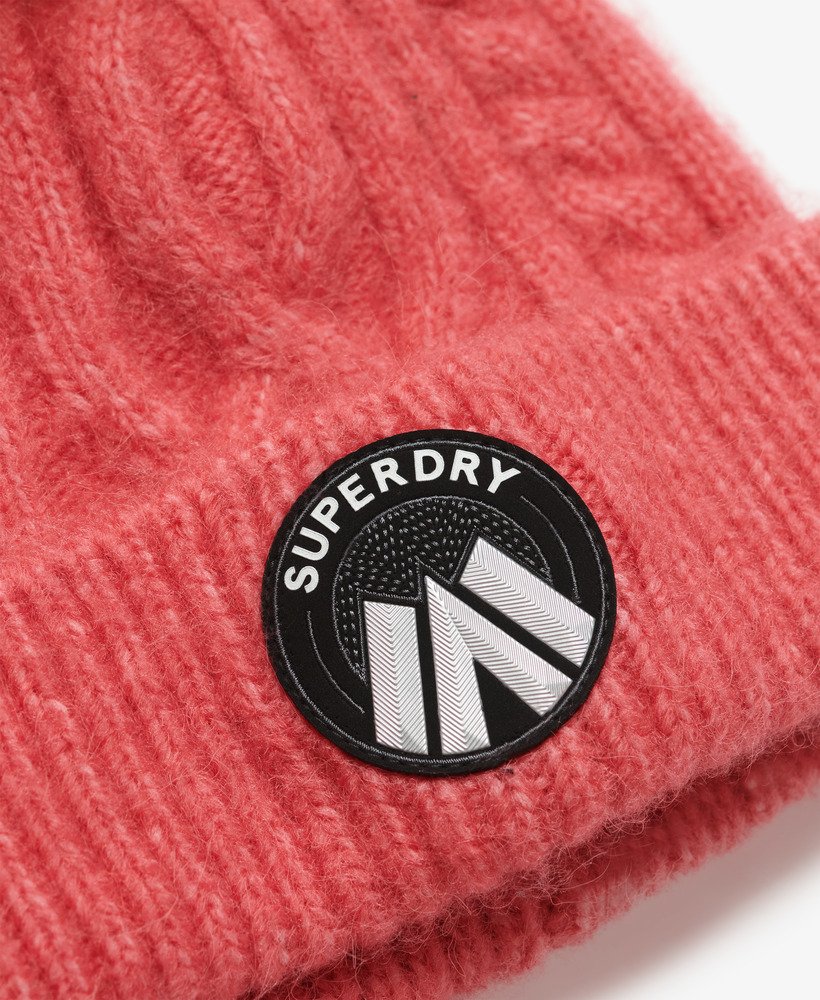 gorro de malha trançada cable luxe na cor rosa claro