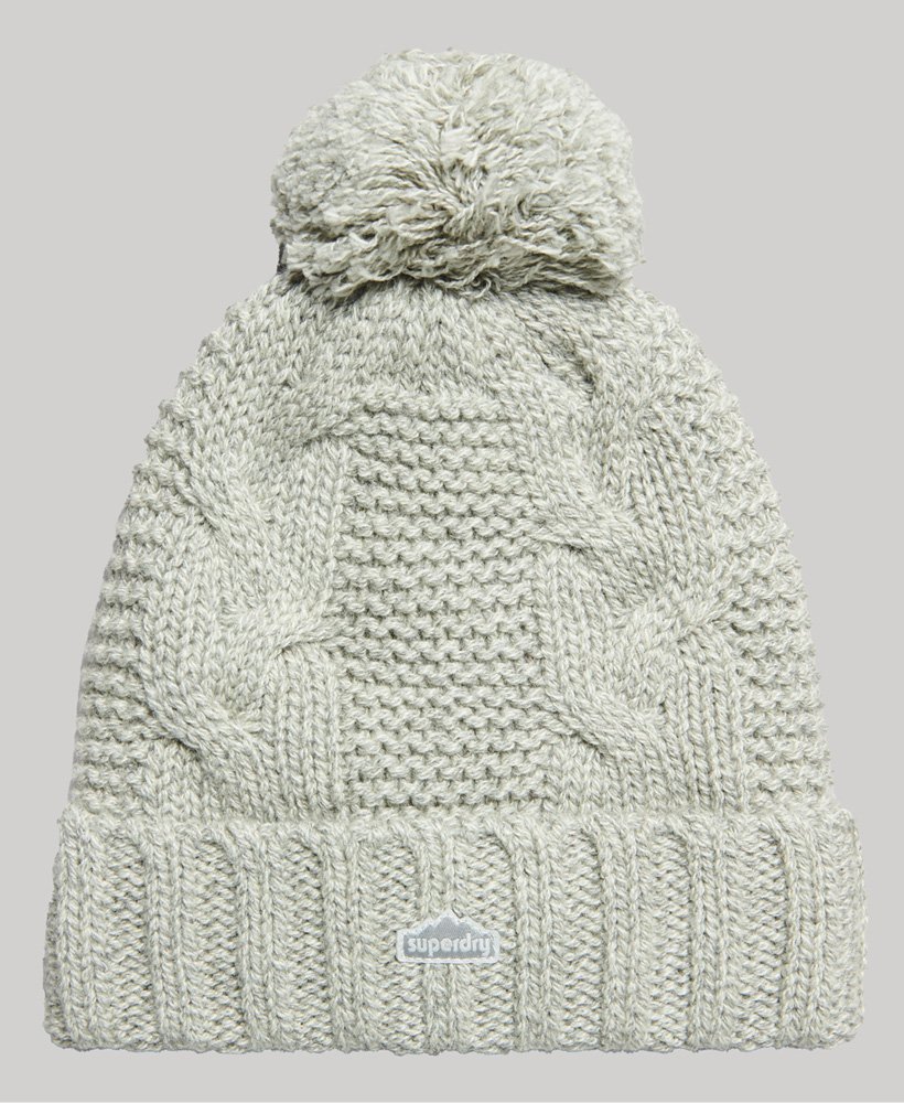 gorro de malha trançada com pompons em tweed cinza claro.