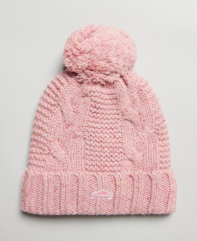gorro de malha trançada com pompom em tweed rosa.