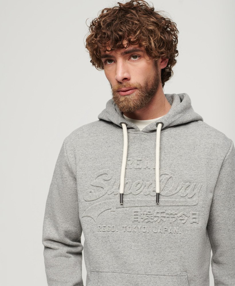 moletom com capuz e logo vintage em relevo na cor cinza claro true grit.