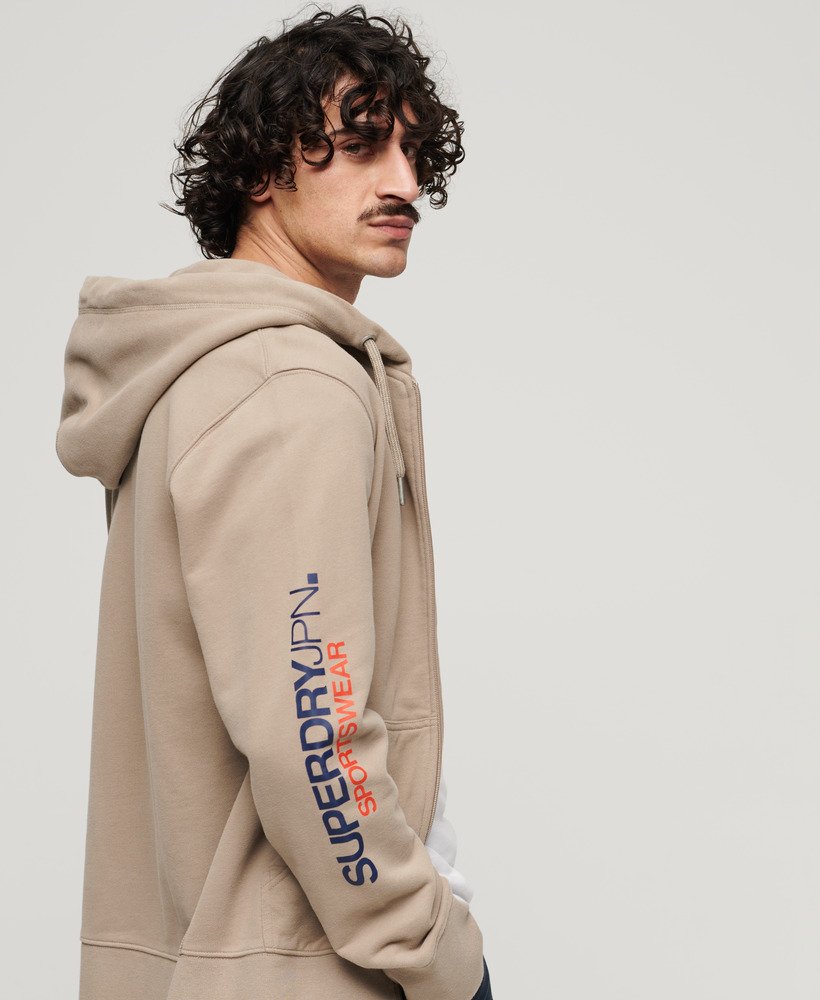 moletom com capuz e zíper estilo folgado com logo da sportswear em tecido texturizado bege escuro.