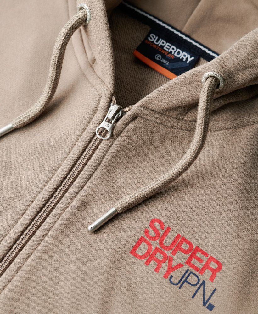 moletom com capuz e zíper estilo folgado com logo da sportswear em tecido texturizado bege escuro.