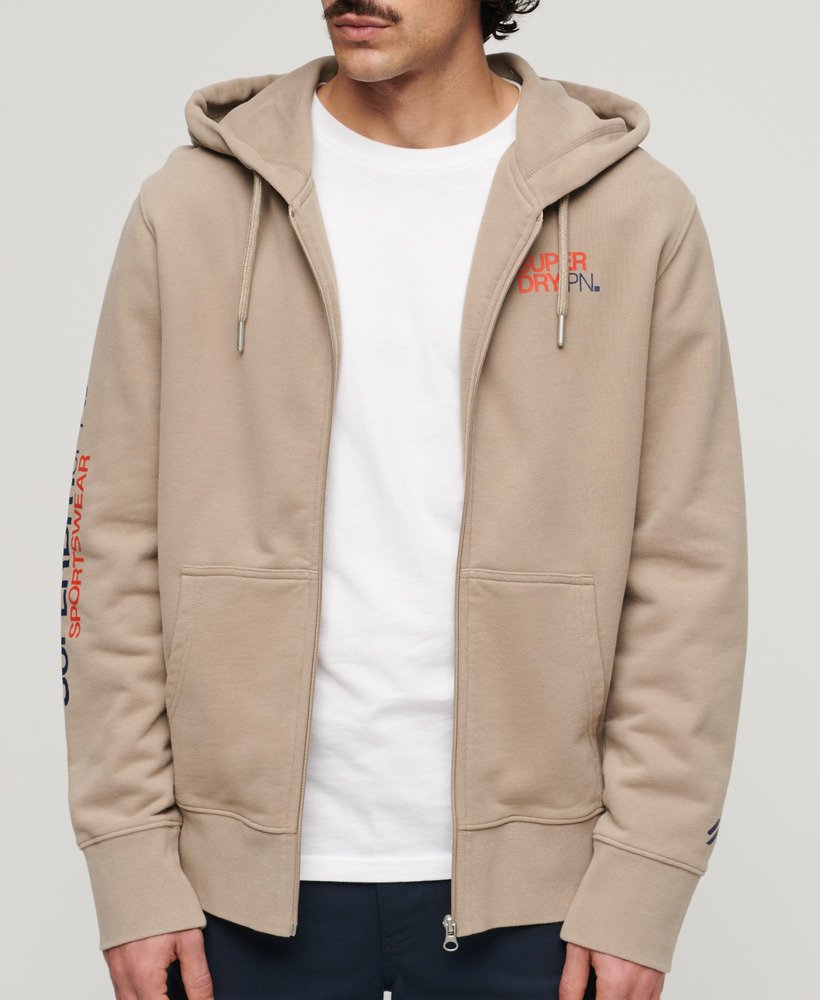 moletom com capuz e zíper estilo folgado com logo da sportswear em tecido texturizado bege escuro.