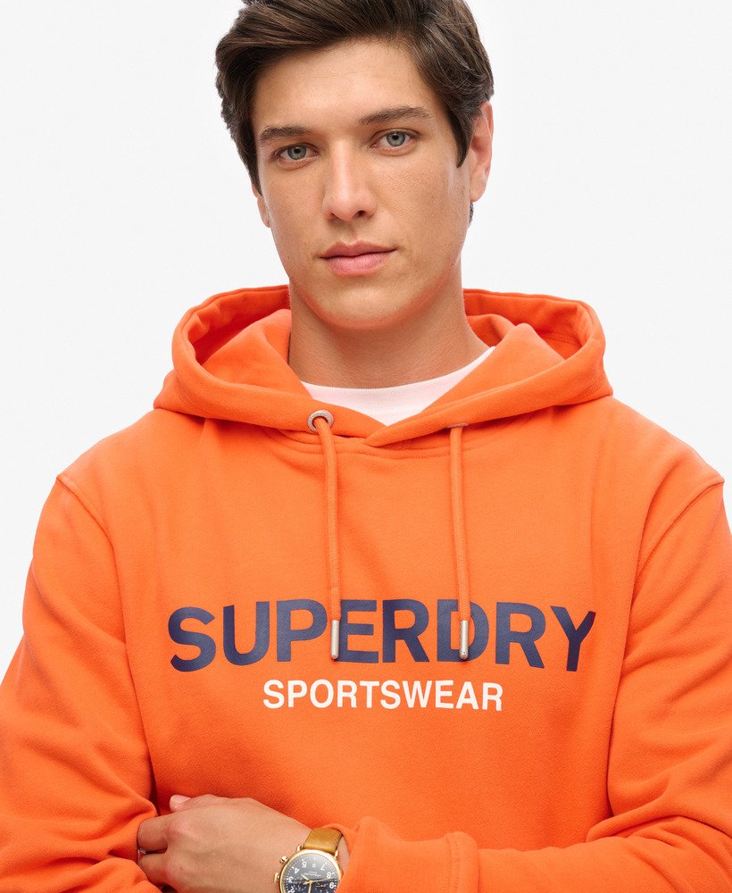 moletom com capuz folgado com logo da sportswear na cor laranja vibrante.