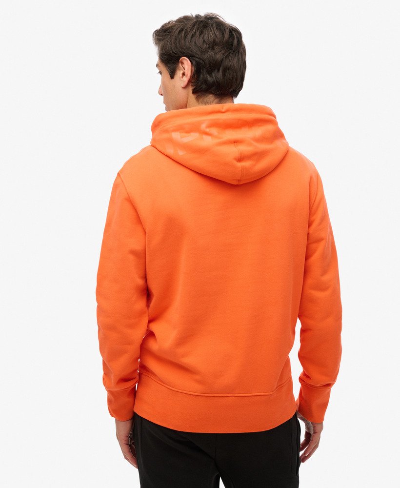 moletom com capuz folgado com logo da sportswear na cor laranja vibrante.