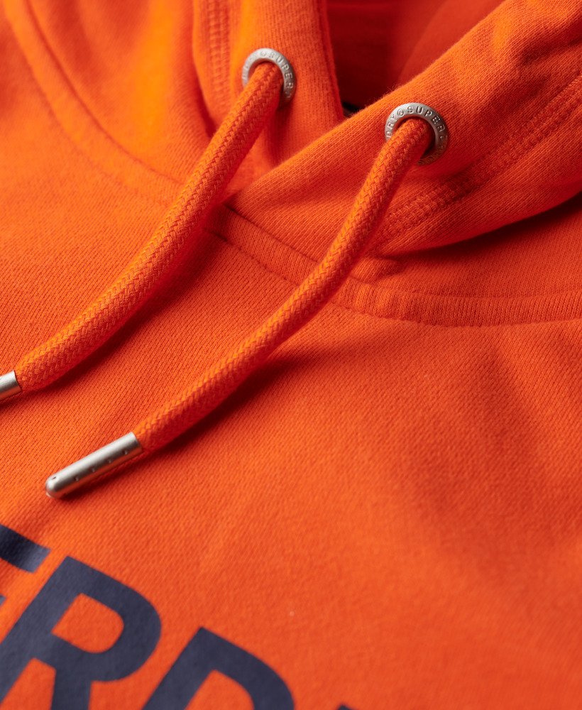 moletom com capuz folgado com logo da sportswear na cor laranja vibrante.