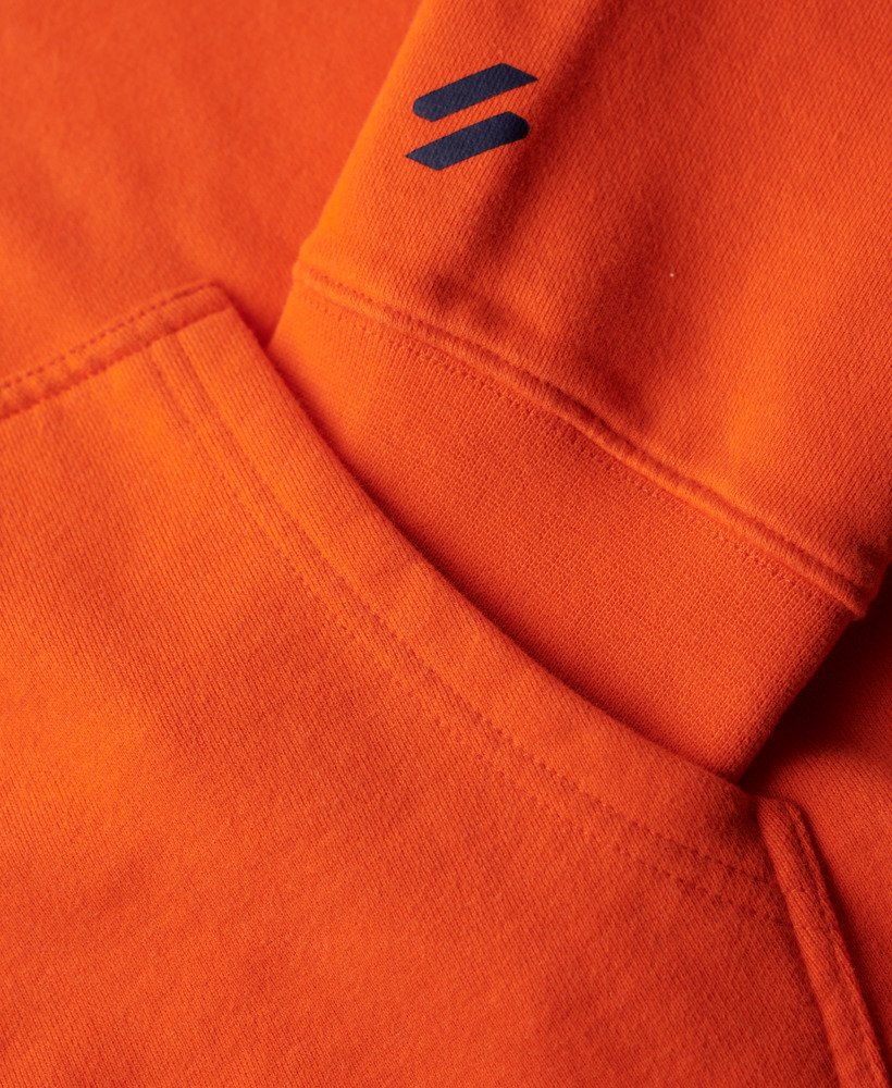 moletom com capuz folgado com logo da sportswear na cor laranja vibrante.