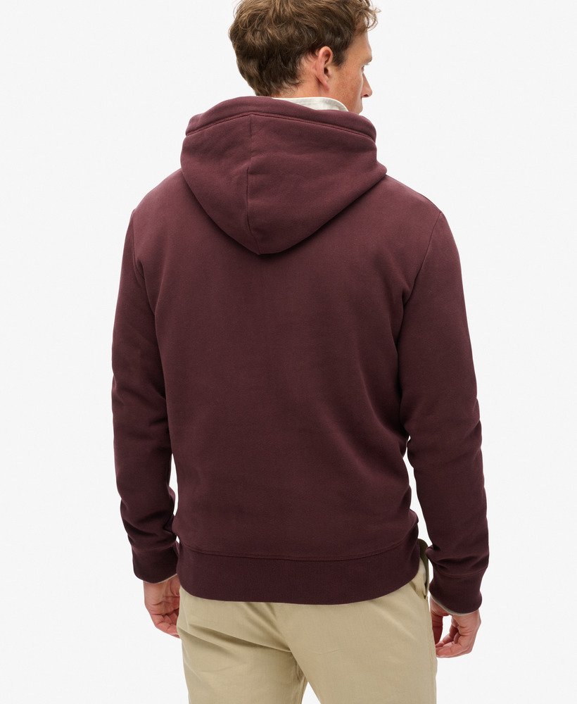 moletom com capuz essential logo em um tom profundo e rico de vinho.