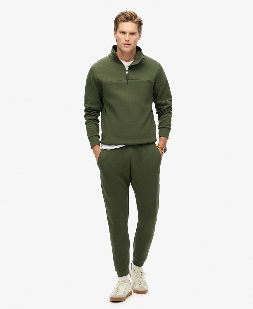 moletom tech loose com meio zíper na cor verde musgo escuro