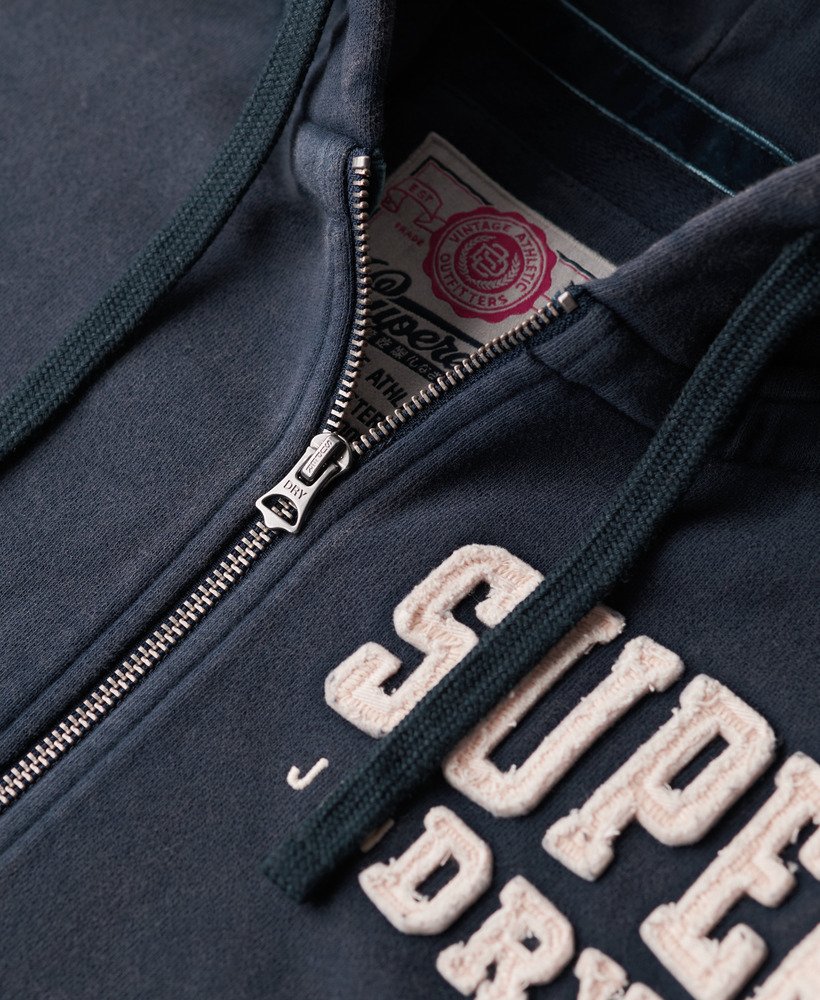 moletom com zíper vintage athletic na cor azul marinho intenso.