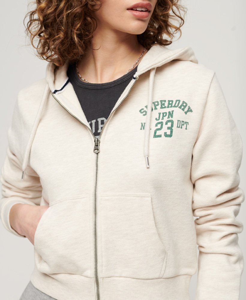 moletom cropped com zíper athletic essentials na cor bege mesclado.