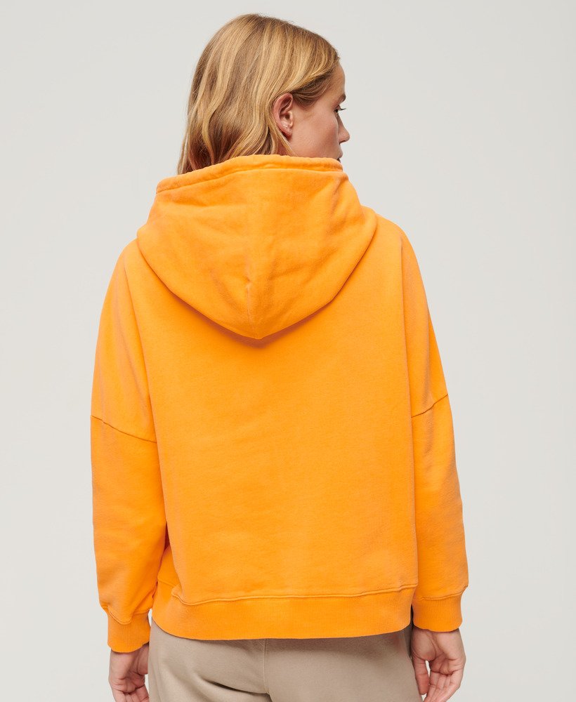 moletom boxy com logo esportivo na cor laranja vibrante.