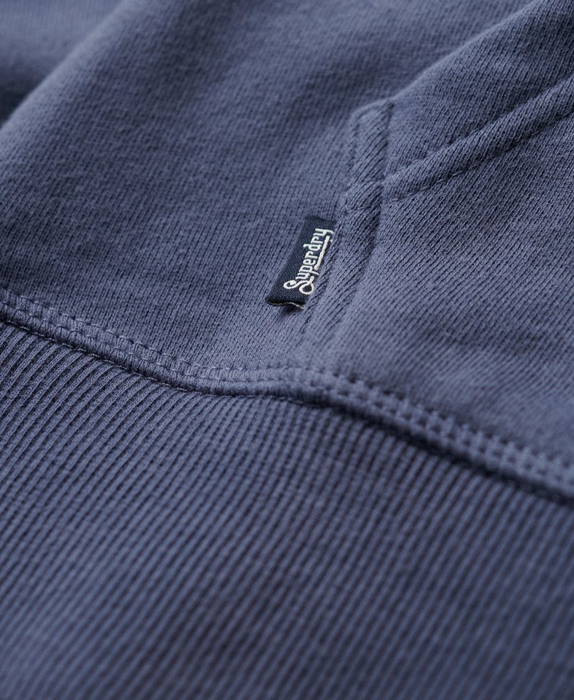 moletom com zíper e logo essencial na cor azul marinho.