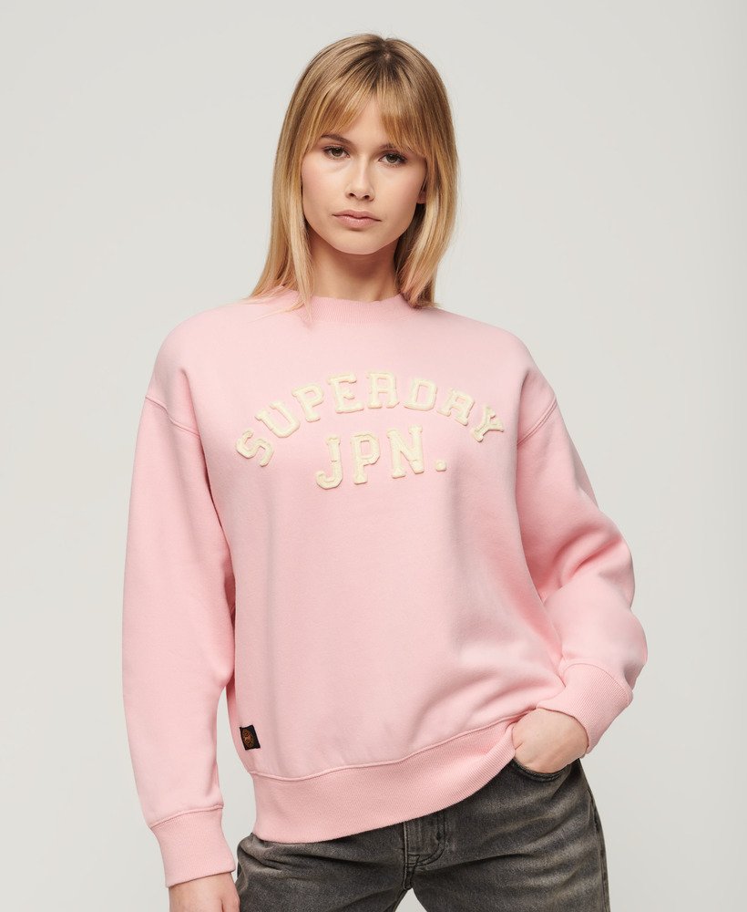 moletom folgado esportivo com apliques na cor rosa romance.