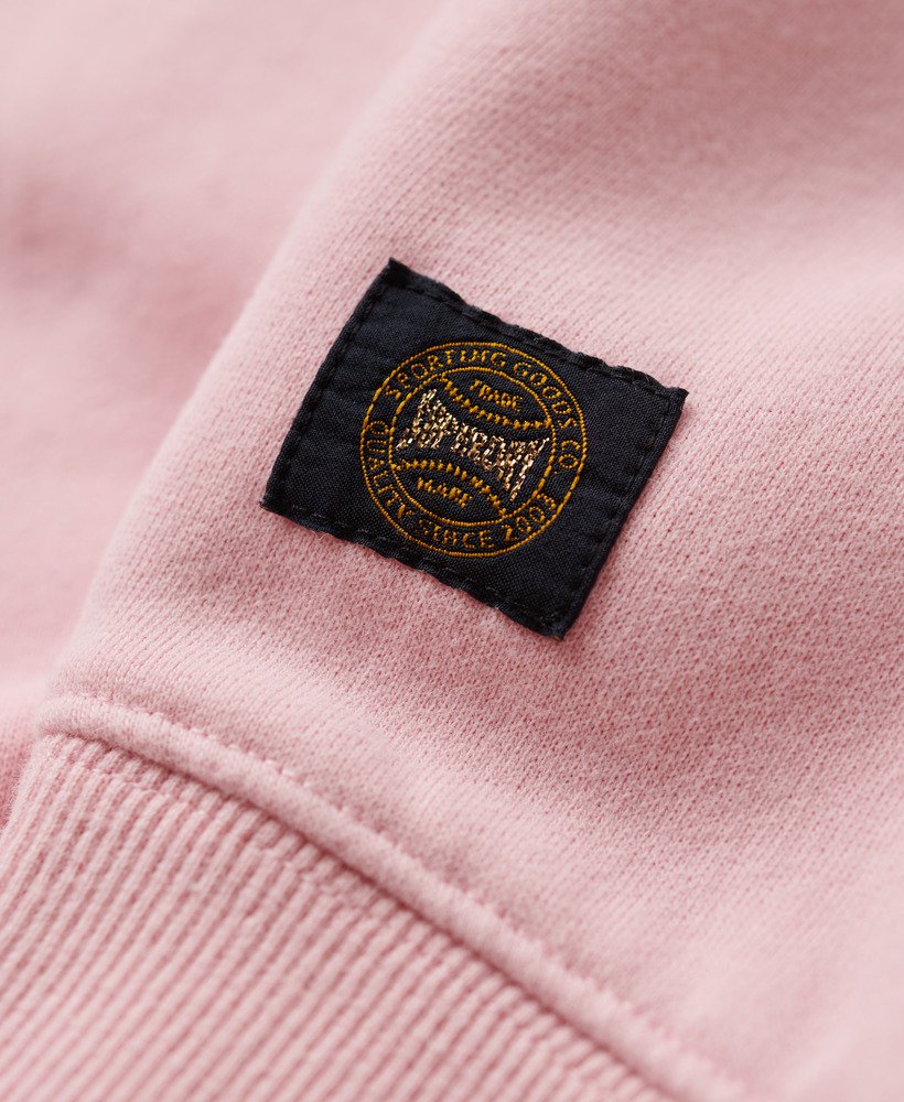 moletom folgado esportivo com apliques na cor rosa romance.
