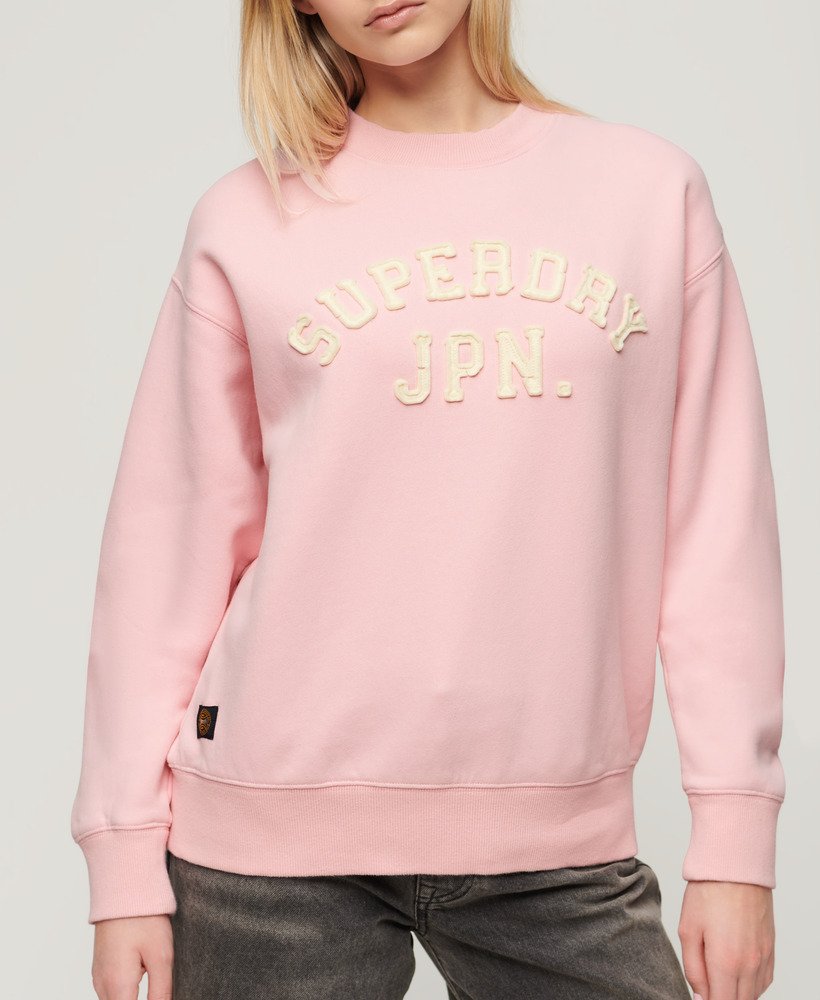 moletom folgado esportivo com apliques na cor rosa romance.