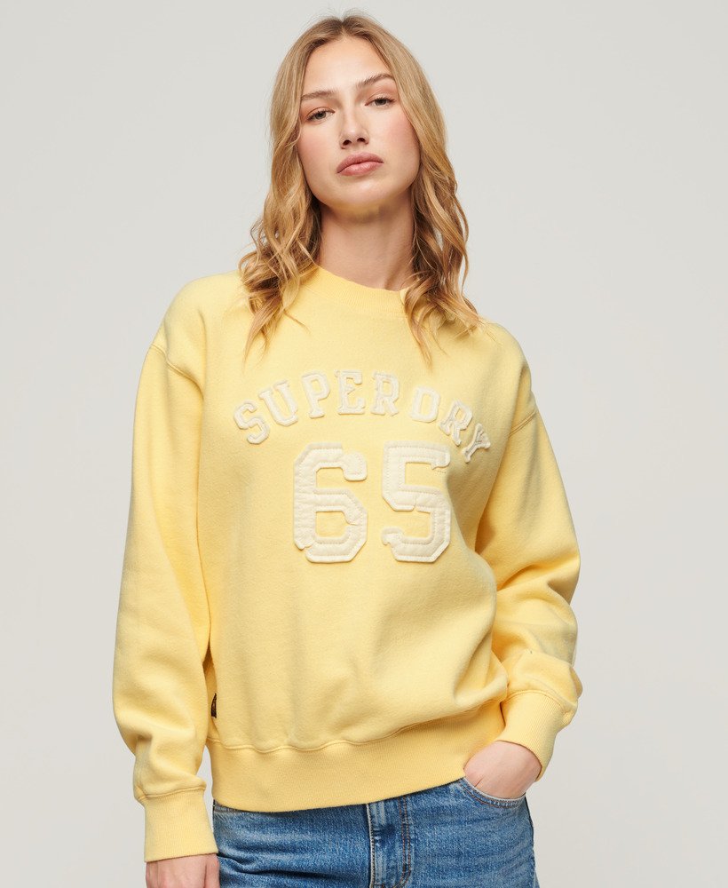 moletom esportivo folgado com apliques em amarelo claro