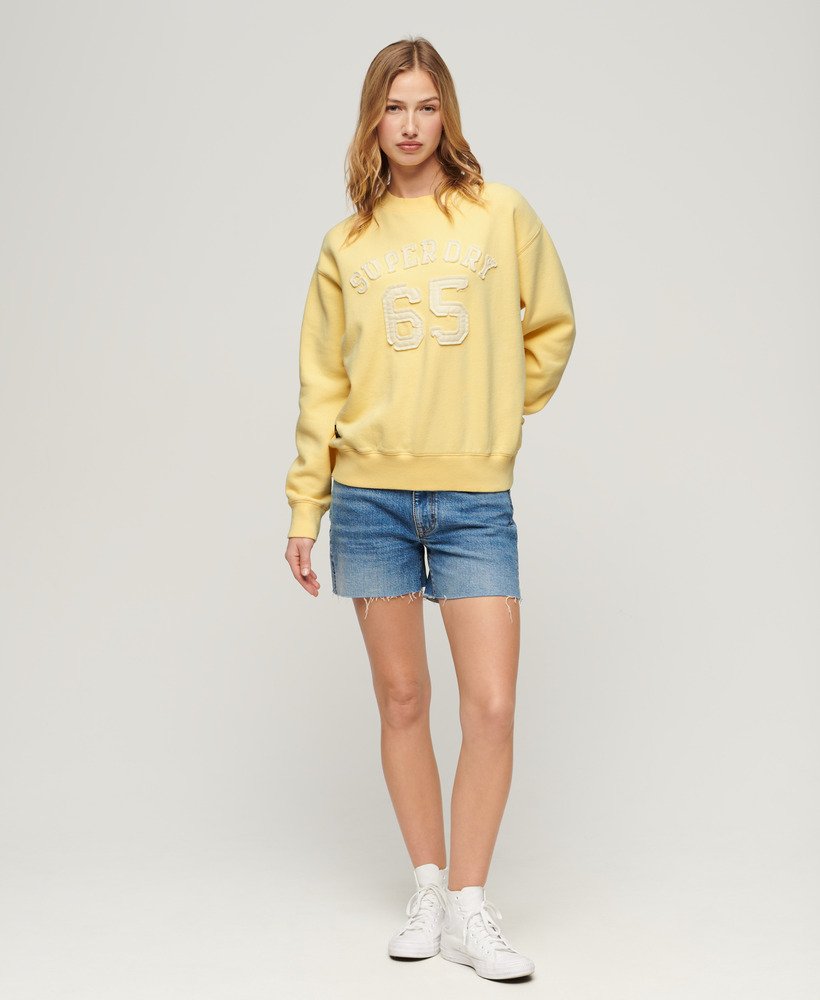 moletom esportivo folgado com apliques em amarelo claro